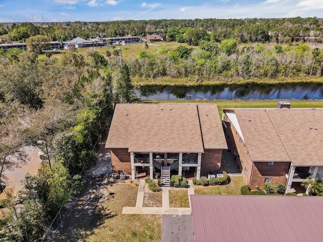 aerial view with a view of trees and a water view