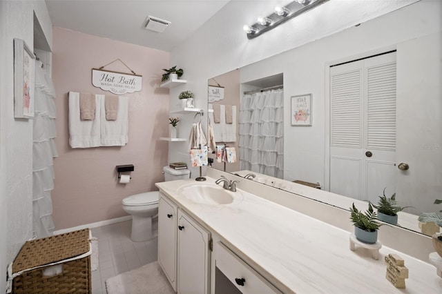 full bathroom featuring vanity, baseboards, visible vents, a closet, and toilet