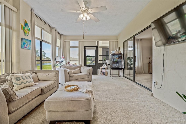 sunroom / solarium with a ceiling fan