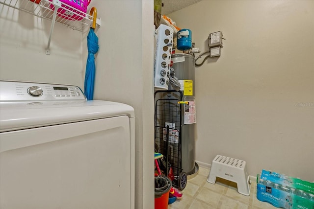 laundry area with strapped water heater, laundry area, washer / clothes dryer, and baseboards