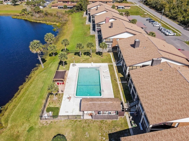 birds eye view of property with a water view