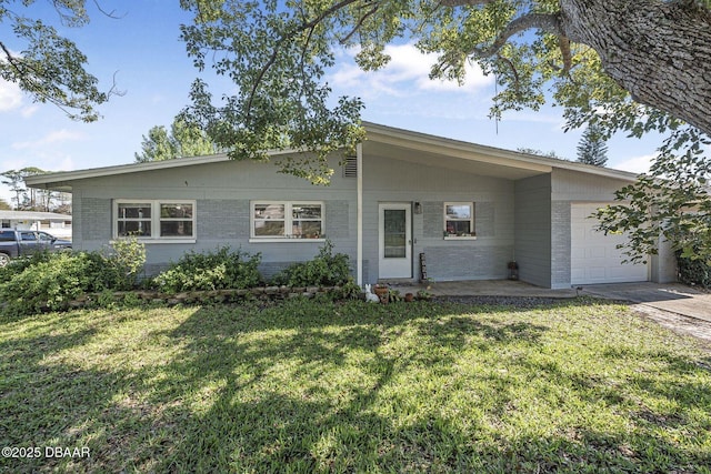 single story home with a front lawn, concrete driveway, brick siding, and an attached garage