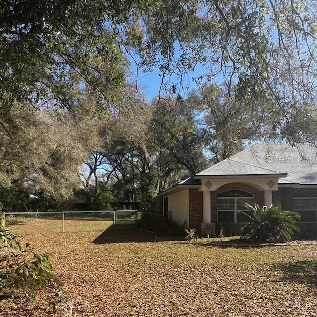 view of yard featuring fence