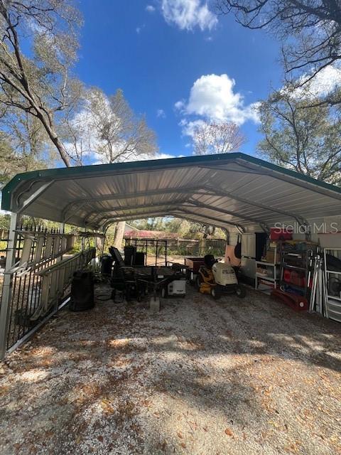 view of parking / parking lot with a detached carport