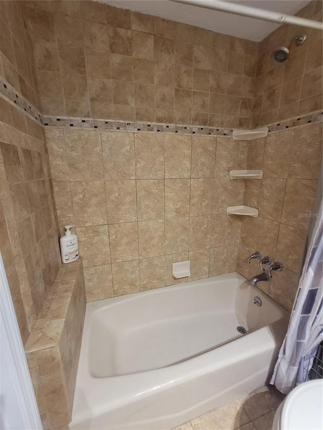 bathroom with shower / bathtub combination with curtain