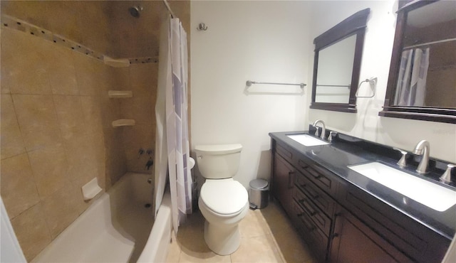 bathroom with double vanity, a sink, toilet, and shower / tub combo with curtain