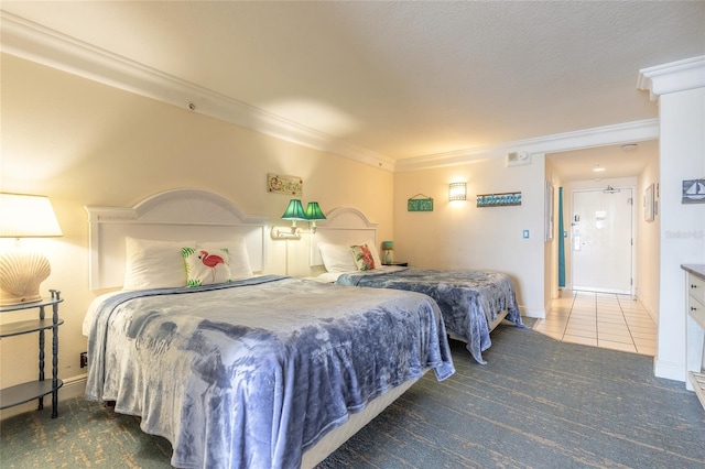 bedroom with baseboards and ornamental molding