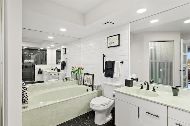 bathroom featuring toilet, vanity, a bath, and recessed lighting