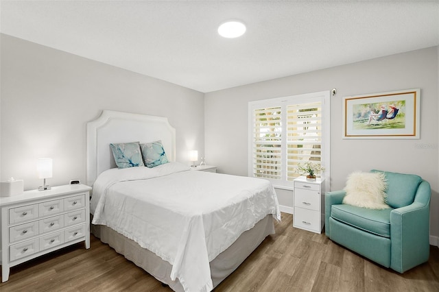 bedroom with wood finished floors