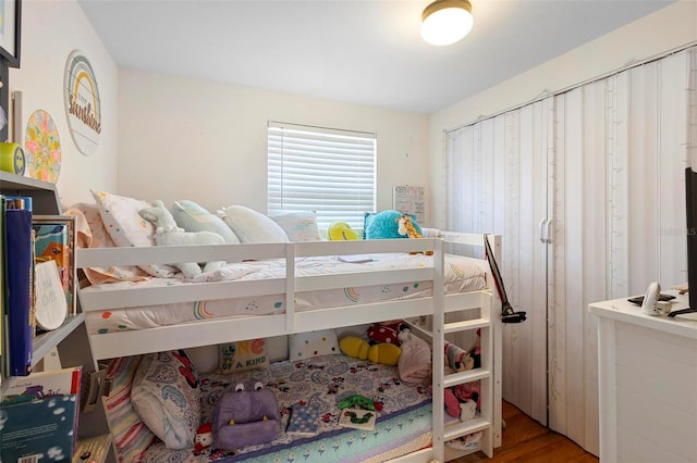 bedroom with wood finished floors