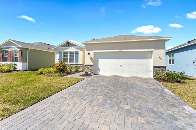 ranch-style house featuring a garage, stone siding, decorative driveway, a front yard, and stucco siding