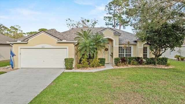 view of front facade with stucco siding, a garage, concrete driveway, and a front lawn