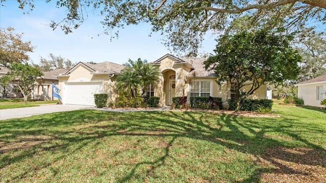 view of front of home featuring stucco siding, driveway, a front lawn, and a garage