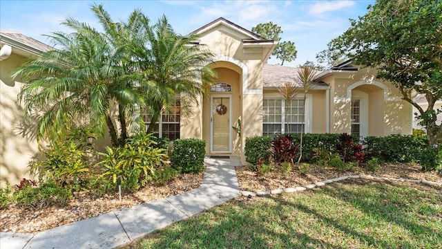 view of front of house featuring stucco siding