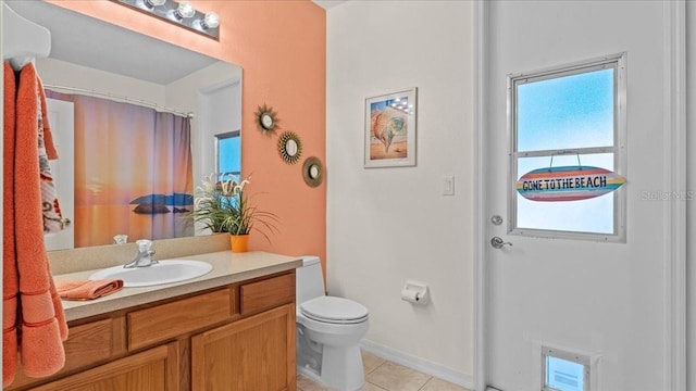 full bathroom featuring vanity, tile patterned floors, toilet, and a shower with curtain