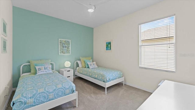 carpeted bedroom with baseboards