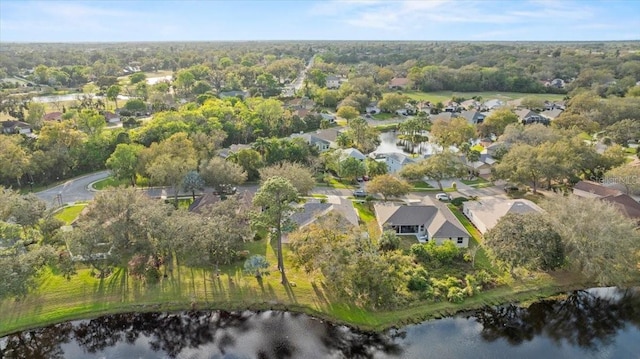 birds eye view of property with a water view and a residential view