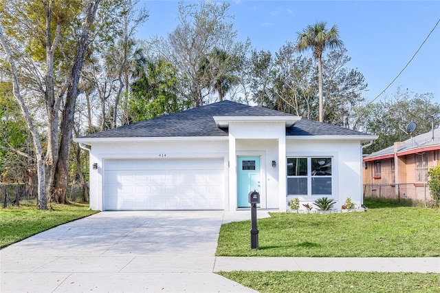 ranch-style house with driveway, stucco siding, roof with shingles, an attached garage, and a front yard