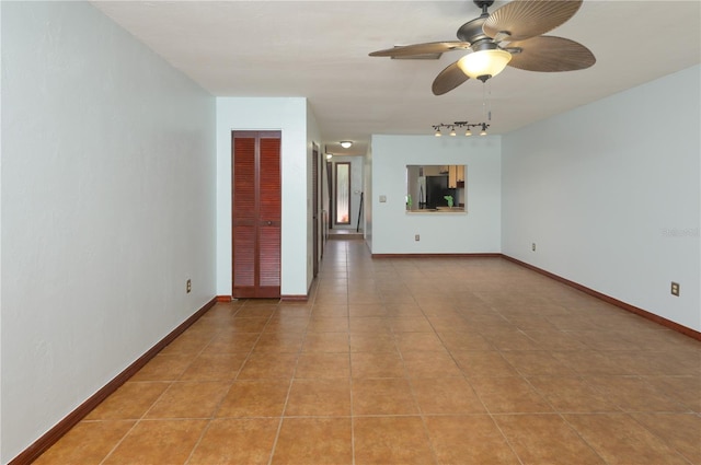 3960 Willow Trail Run Unit 45, Port Orange, FL 32127 - empty room featuring track lighting, ceiling fan, and light tile patterned floors