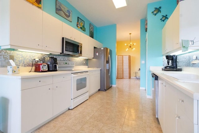 kitchen with stainless steel appliances, backsplash, light countertops, and a notable chandelier