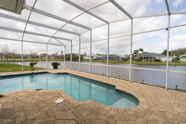 pool featuring a lanai, a patio area, and a water view