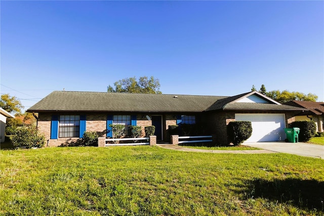 single story home featuring an attached garage, a front yard, concrete driveway, and brick siding