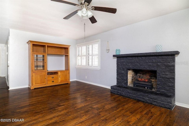 unfurnished living room featuring dark wood-style flooring, a fireplace, and baseboards