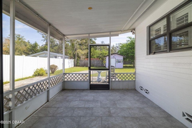 unfurnished sunroom with a healthy amount of sunlight