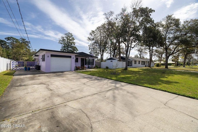 ranch-style home featuring a garage, concrete driveway, a front lawn, and fence