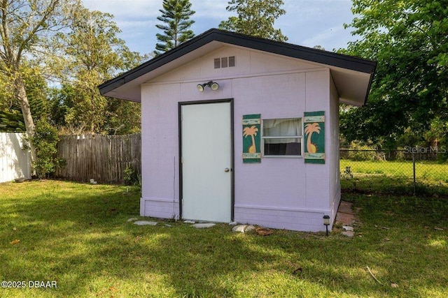 view of shed with fence