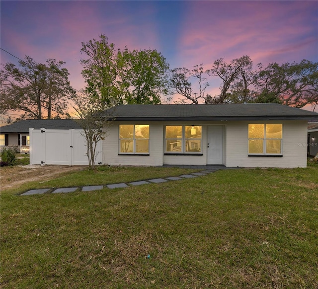 view of front of house with a lawn