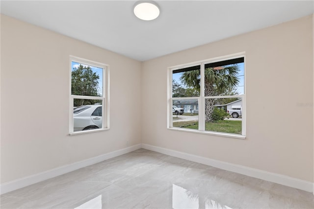 empty room with baseboards