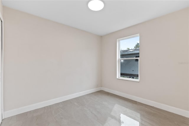 empty room featuring baseboards