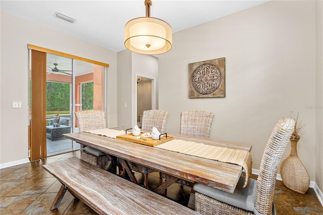 dining area with visible vents, a ceiling fan, and baseboards