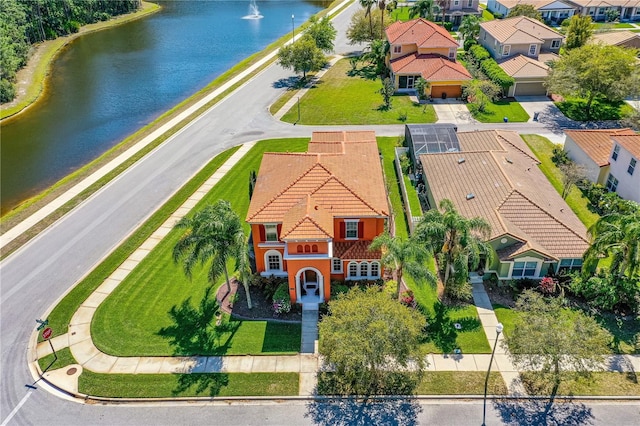 bird's eye view featuring a residential view and a water view