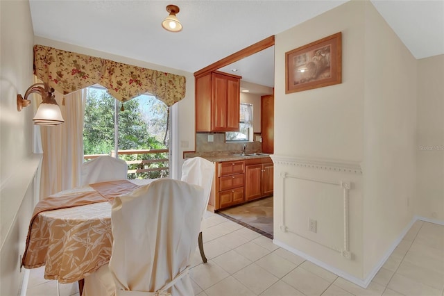 dining space with light tile patterned floors