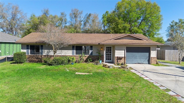 single story home featuring driveway, an attached garage, fence, a front lawn, and brick siding