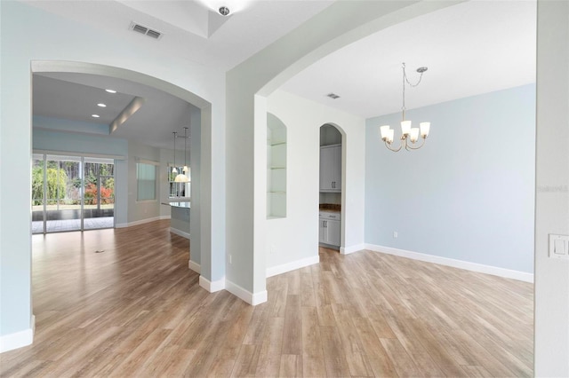 empty room featuring recessed lighting, baseboards, visible vents, and light wood finished floors