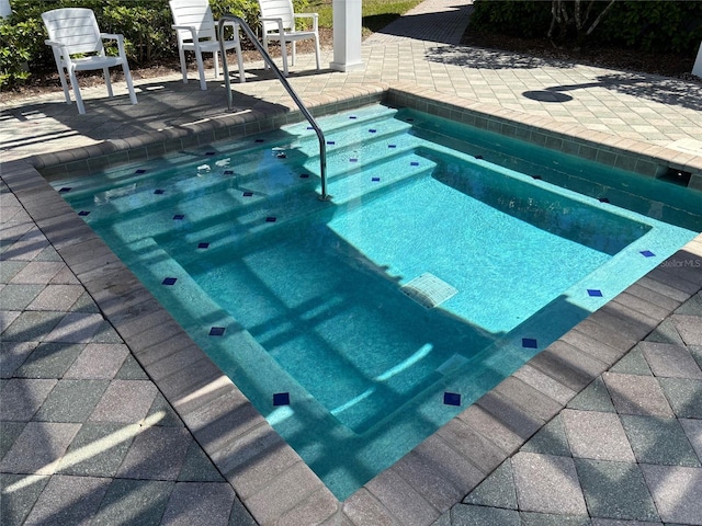 view of swimming pool with a patio area