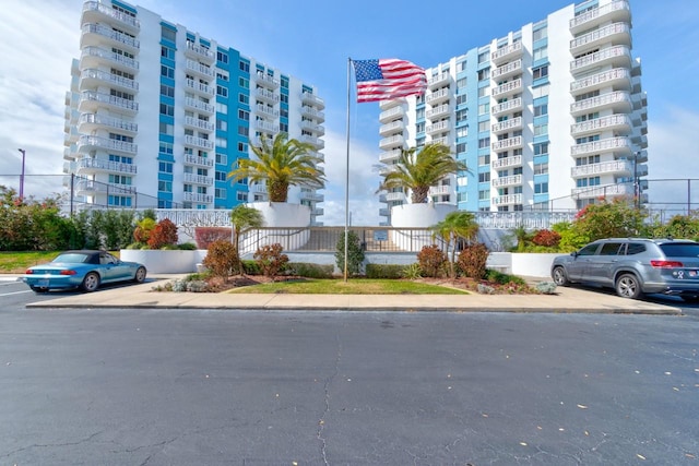 view of property featuring uncovered parking