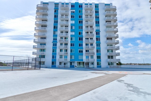 view of property with fence