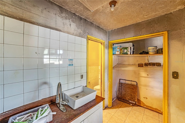 bathroom with tile patterned flooring and toilet