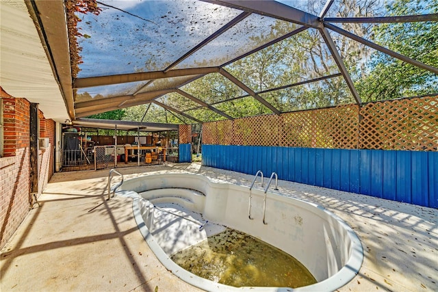 view of pool featuring a lanai and a patio