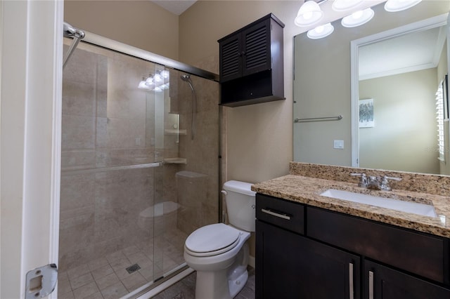 bathroom with ornamental molding, a stall shower, vanity, and toilet