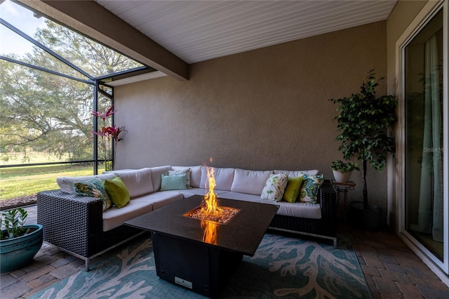 sunroom / solarium featuring beam ceiling