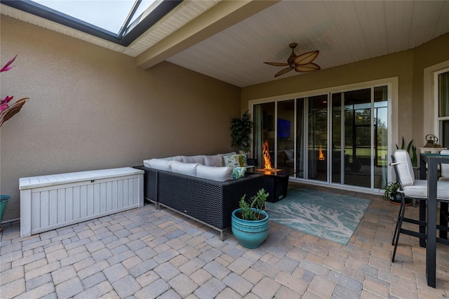 view of patio featuring ceiling fan and an outdoor living space