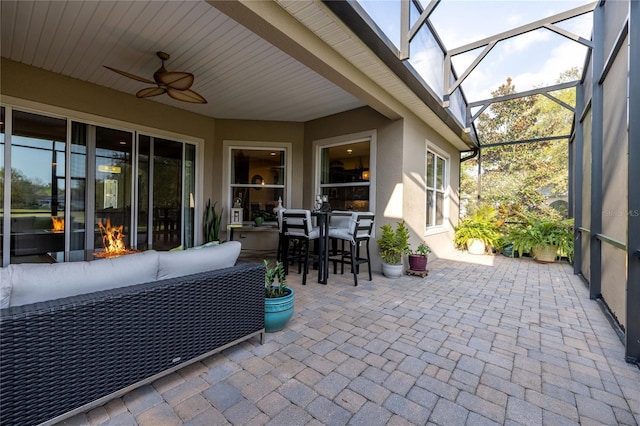 view of patio with ceiling fan, an outdoor hangout area, and a lanai