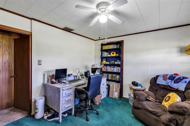 office space with ceiling fan, ornamental molding, dark carpet, and visible vents