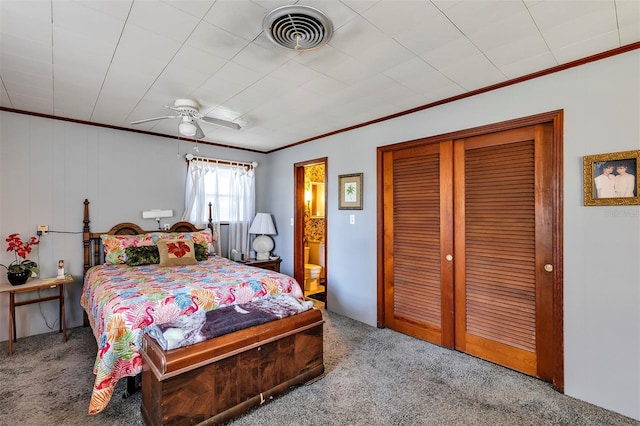 carpeted bedroom with ceiling fan, a closet, visible vents, and crown molding