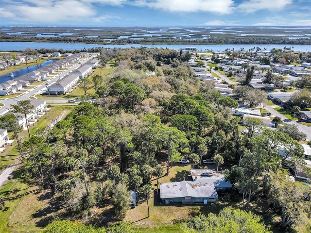 birds eye view of property with a residential view and a water view